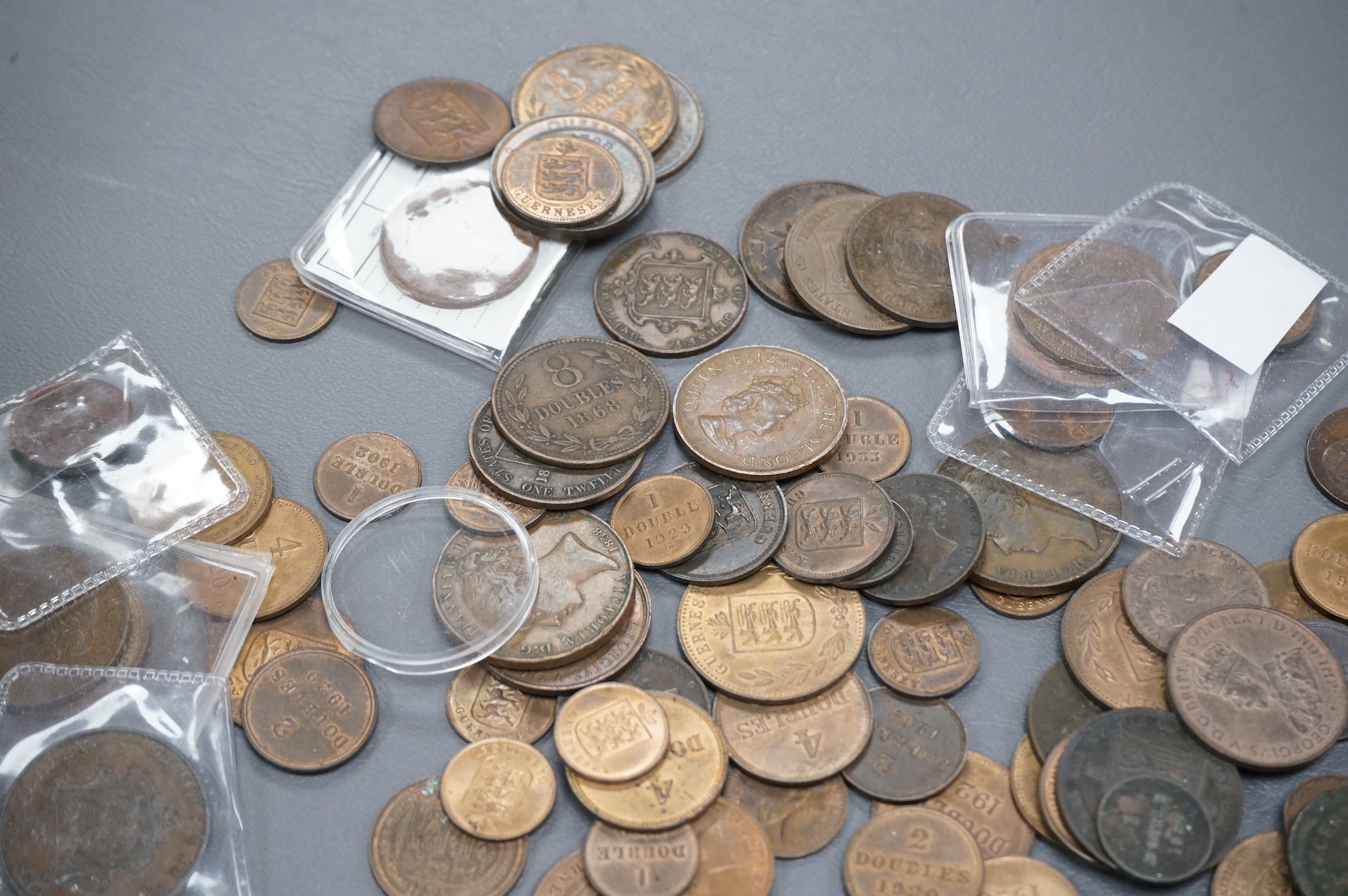 A collection of Guernsey and Channel Islands coins, Victoria to George V, many EF to UNC, Together with a C. Brooke rajah Sarawak, one cent, 1870, about EF